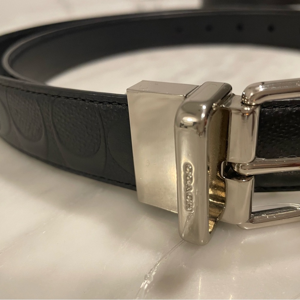 Men’s Coach Black Embossed Leather Belt with Silver Buckle.